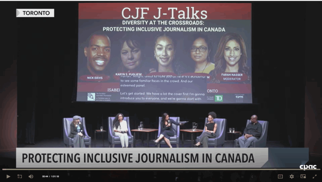 Panelists on a stage under a CJF J-Talks Banner